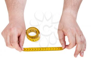 male hands with tailor measuring tape isolated on white background