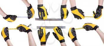 set of worker hands in safety glowes with measuring tools isolated on white background