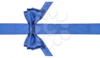 symmetric blue satin bow with vertically cut ends on silk ribbon isolated on white background