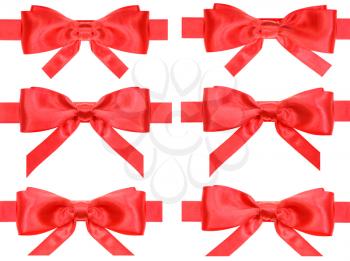 set of red bow knots on satin ribbons isolated on white background