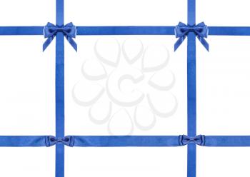 two blue satin bows, two knots and four intersecting ribbons isolated on horizontal white background