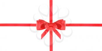 one red satin bow in center and two intersecting ribbons isolated on horizontal white background