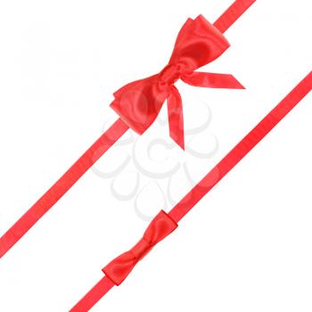 red satin bow and knot and two diagonal ribbons isolated on square white background