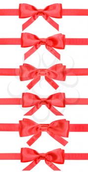 set of red bows on satin ribbons isolated on white background