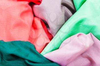 several pieces of silk batiste fabrics close up