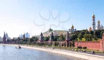 Moscow skyline - panoramic view of The Kremlin embankment, Kremlin buildings, walls, towers, Moscow City in summer afternoon
