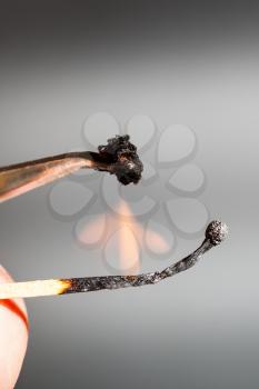 experiment to determine the composition of tissue - match flame ignites silk textile sample