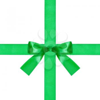 one big green bow knot on two crossing silk ribbons isolated on white background