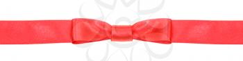 symmetrical red bow knot on narrow satin ribbon isolated on white background