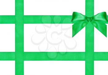 one big green bow knot on four satin strips isolated on white background