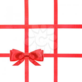 one red satin bow in lower left corner and four intersecting ribbons isolated on square white background