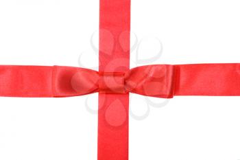 intersection of red satin ribbon and red tape with bow isolated on white background