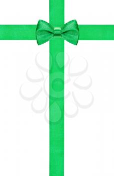 green bow knot on two crossing silk strips isolated on white background