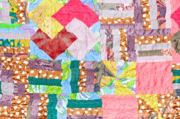 textile background from handmade silk patchwork cloth