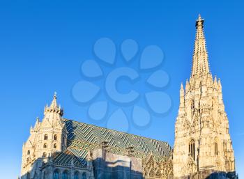 travel to Vienna city - towers of St. Stephen cathedral in Vienna and blue sky, Austria