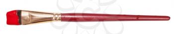 flat artistic paint brush with red painted tip isolated on white background