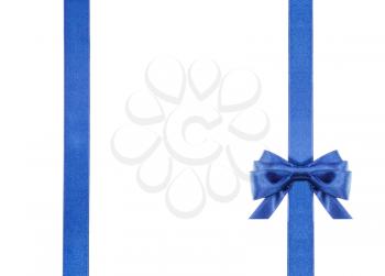 one blue satin bow in lower right corner and two vertical ribbons isolated on horizontal white background