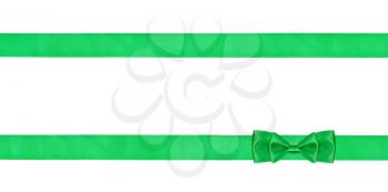 double green bow knot on two parallel silk ribbons isolated on white background