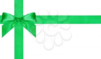 one big green bow knot on two crossing satin bands isolated on white background