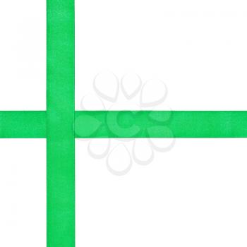 two crossing green satin bands isolated on white background