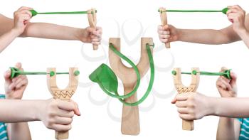 set of female hands with wooden slingshot isolated on white background