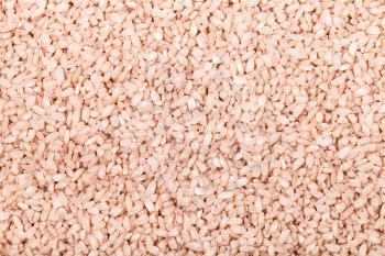 food background - medium grains of uncooked red Matta (Devzira) rice
