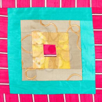 textile background - square pattern of patchwork cloth