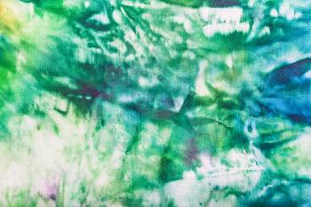textile background - abstract hand painted green and blue nodular batik