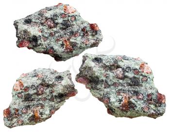 macro shooting of natural mineral stone - three pieces of Eclogite rocks from garnet (red) and omphacite (greyish-green) groundmass isolated on white background