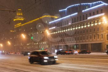 snowfall in night city - car driving under snow on Garden Ring Street, Moscow