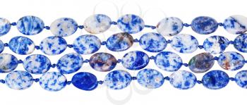 beads from blue lapis lazuli gem stone isolated on white background