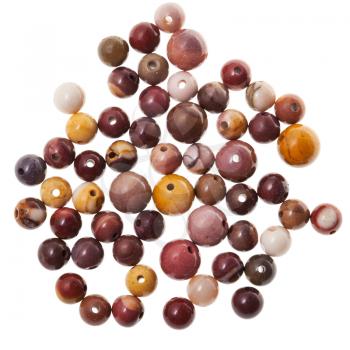 many little beads from mookaite (australian jasper) gemstone on white background
