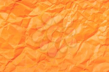 background from orange colour crumpled paper