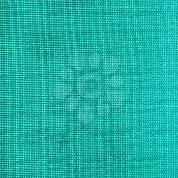 square textile background - green silk Taffeta fabric with weave pattern of threads close up