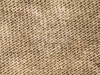 textile background - brown cotton cloth with Jersey (stockinette) Structure weave pattern of threads close up