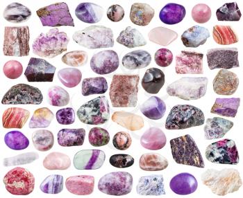 set of purple natural mineral stones and gemstones isolated on white background
