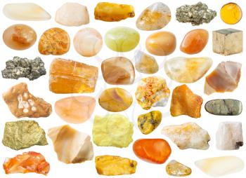 set of yellow and orange natural mineral stones and gemstones isolated on white background
