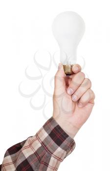 male hand holds incandescent lamp isolated on white background