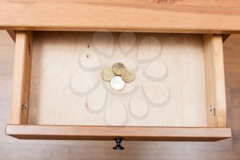 above view of pile of euro cent coins in open drawer of nightstand