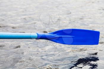 paddle blade over water during boating on river