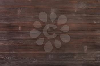 textured background - wooden surface of dark brown color