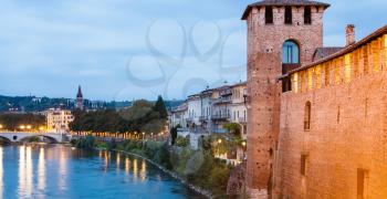 travel to Italy - city walls and waterfront of Adige river in Verona in evening