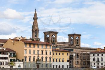 travel to Italy - houses on quay lungarno delle grazie of Arno River and towers of Basilica di Santa Croce (Basilica of the Holy Cross) in Florence city in autumn