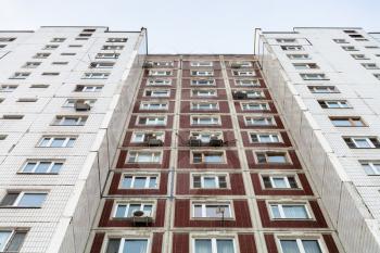 facade of multistory apartment house in winter day