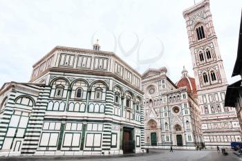 travel to Italy - view of Florence Baptistery (Battistero di San Giovanni, Baptistery of Saint John) and Duomo Cathedral Santa Maria del Fiore with Giotto's Campanile on Piazza San Giovanni in morning