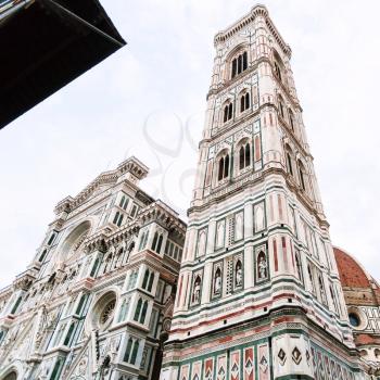 travel to Italy - facades of Giotto's Campanile and Duomo Cathedral (Cattedrale Santa Maria del Fiore, Duomo di Firenze, Cathedral of Saint Mary of the Flowers) in Florence city in morning