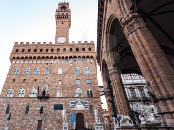travel to Italy - Facade of Palazzo Vecchio (Old Palace, Town Hall) and Loggia dei Lanzi in Florence city in morning