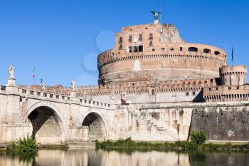 travel to Italy - exterior of Castel Sant Angelo (Castle of the Holy Angel, Mausoleum of Hadrian) and bridge of St Angel in Rome city from Tiber river in sunny day
