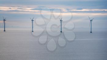 Travel to Denmark - view of offshore wind farm Middelgrunden in Oresund near Copenhagen city in Baltic Sea in blue autumn morning