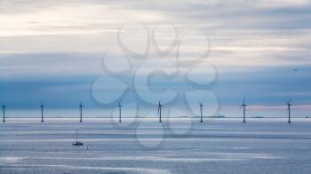 Travel to Denmark - view of Baltic Sea with offshore wind farm Middelgrunden in Oresund near Copenhagen city in blue autumn morning